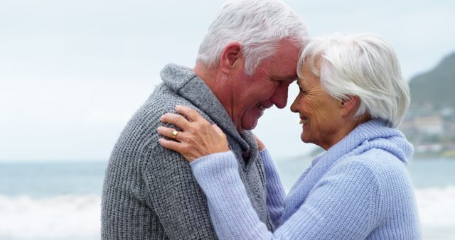 Loving Senior Couple Embracing at Beach - Download Free Stock Images Pikwizard.com