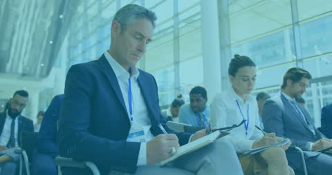 Business Conference with Diverse Professionals Collaborating