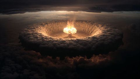 Dramatic eruption: fiery mushroom cloud in dense sky