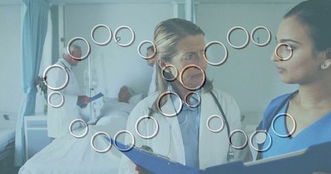 Medical Team Discussing Patient Treatment in Hospital Room