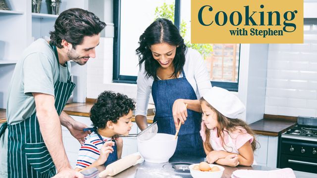 Diverse family standing in modern kitchen, parents and children preparing meal together. Image useful for blogs, cooking websites, family-oriented advertisements, culinary classes, and parenting articles.