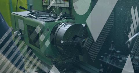 Metal lathe with four-jaw chuck in industrial workshop