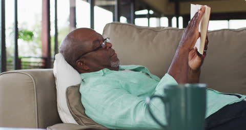 Senior Man in Leisurely Reading Moment at Home