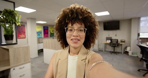 Confident Business Professional Taking Selfie in Modern Office