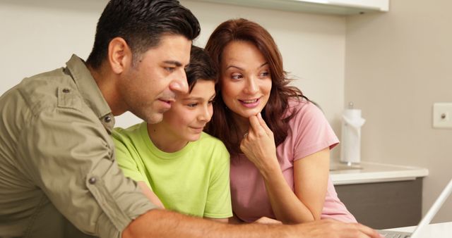 Family Using Laptop at Home for Online Learning and Entertainment - Download Free Stock Images Pikwizard.com