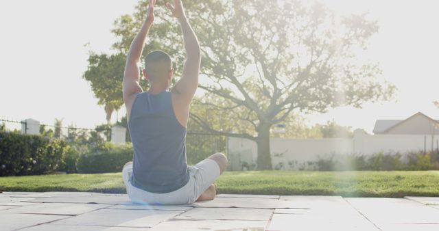 Man Meditating in Sunlit Garden Practicing Yoga - Download Free Stock Images Pikwizard.com