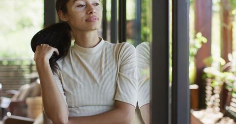 Reflective Biracial Woman Looking Outside through Window - Download Free Stock Images Pikwizard.com