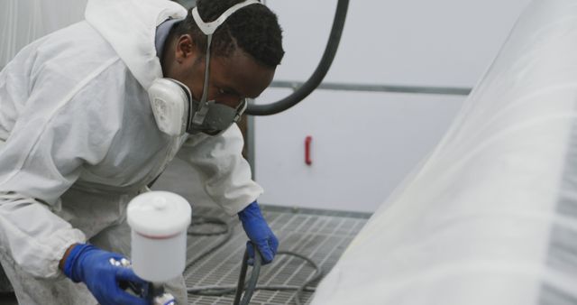 Professional Auto Painter Wearing Protective Gear Working in Vehicle Workshop - Download Free Stock Images Pikwizard.com