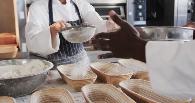 Bakers Sifting Flour in a Commercial Bakery Kitchen - Download Free Stock Images Pikwizard.com