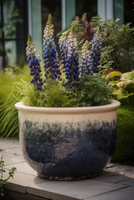 Blue flowers in ceramic planter in garden, created using generative ai technology. Flowers, plants, growth, spring, nature and gardening concept digitally generated image.