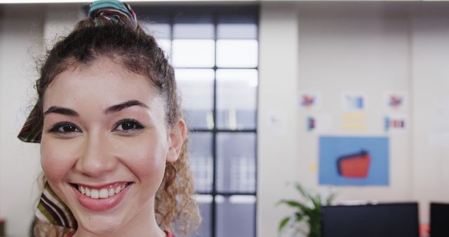 Smiling Young Woman in Modern Office Setting - Download Free Stock Images Pikwizard.com