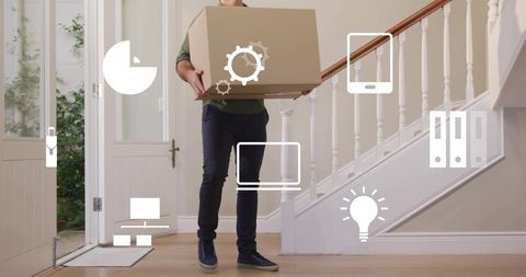 Man carrying moving box into home foyer with staircase and technology icons overlay