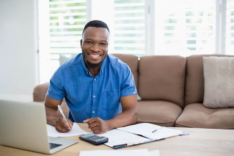 Smiling Professional Assuring Workplace Productivity with Digital Tools