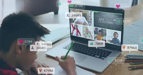 Boy studying at laptop in virtual classroom with onscreen thumbnails and social icons