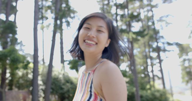 Smiling Young Woman Outdoors in Sunny Forest - Download Free Stock Images Pikwizard.com