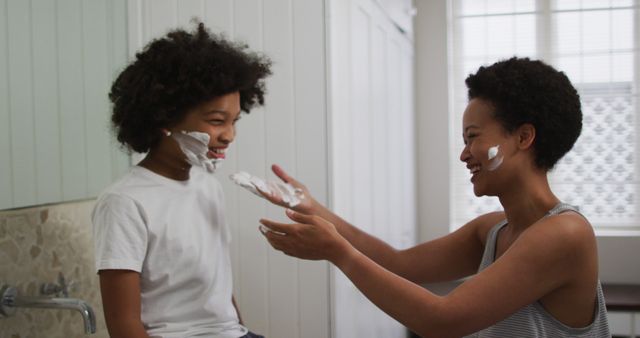 Mother and Young Son Sharing Fun Shaving Cream Moment in Bathroom - Download Free Stock Images Pikwizard.com