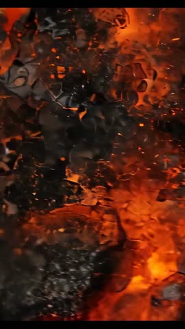 Vertical Macro Video Showing Glowing Embers and Smoldering Coal with Rising Sparks