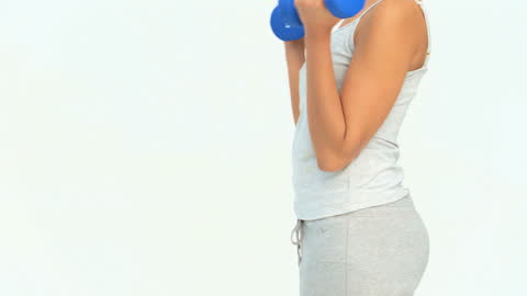 Woman Exercising with Dumbbells in Activewear