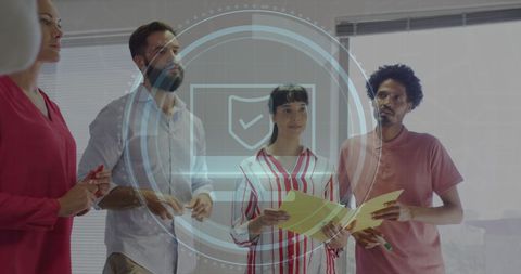 Diverse team collaborating with cyber security digital overlay