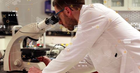 Laboratory Researcher Leaning Over Microscope Adjusting Stage with Tech Data Overlay HUD