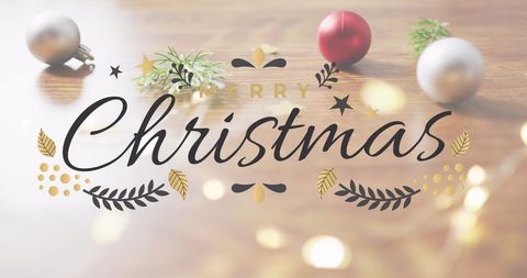 Merry Christmas Greetings with Festive Ornaments on Wooden Surface