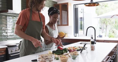 Couple Cooking Healthy Meal in Modern Kitchen with Fresh Vegetables