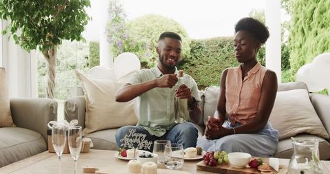 Couple Celebrating Anniversary with Dessert and Wine at Home