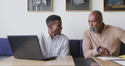 Diverse business professionals engaging in office discussion