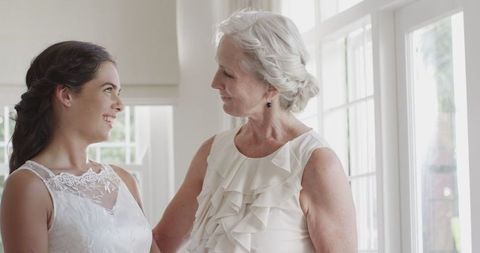 Bride Sharing Moment with Bridesmaid Before Wedding Celebration