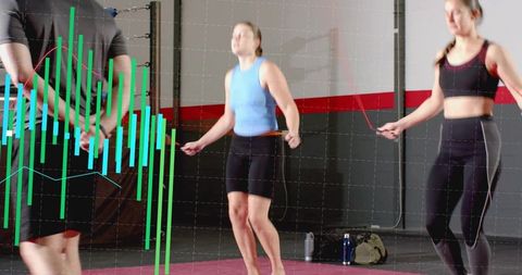 Group skipping rope workout in gym with analytics overlay, high-energy cardio training