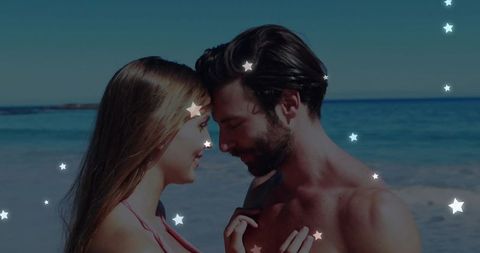 Romantic Couple Embracing on Scenic Beach With Star Overlays