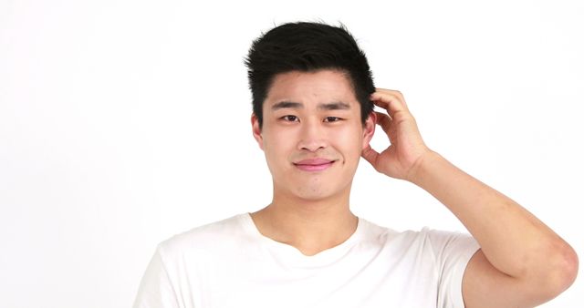 Confused Young Man in White Shirt Scratching Head - Download Free Stock Images Pikwizard.com