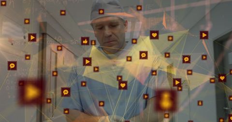 Male doctor engaging with digital data network in hospital