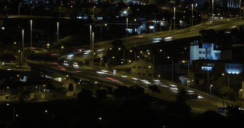 transparent night cityscape with blurred traffic lights and highways - Download Free Stock Videos Pikwizard.com
