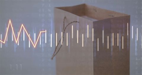 Paper Shopping Bag with Financial Chart Overlay: Retail and Analytics Concept