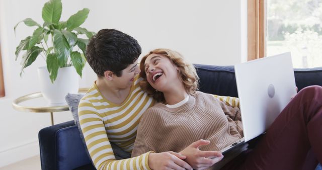 Happy Women Relaxing on Sofa with Laptop in Cozy Living Room - Download Free Stock Images Pikwizard.com