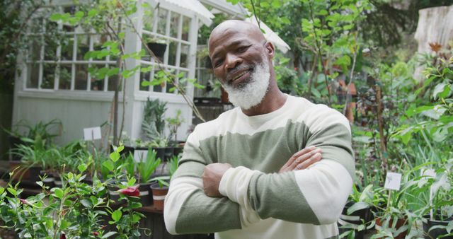 Confident Senior Man Standing in Garden with Arched Arm Pose - Download Free Stock Images Pikwizard.com