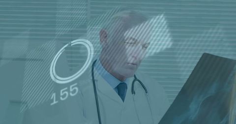 Doctor Examining X-Ray With Digital Interface