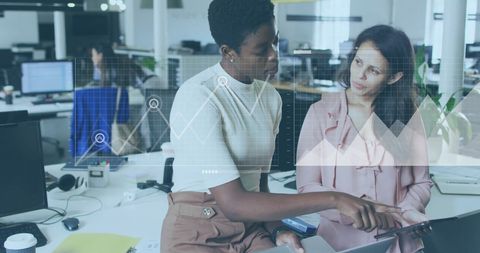 Two Women Analyzing Data on Digital Interface in Modern Office - Download Free Stock Images Pikwizard.com