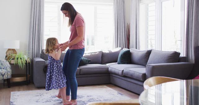 Mother and Daughter Dancing Playfully at Home - Download Free Stock Images Pikwizard.com