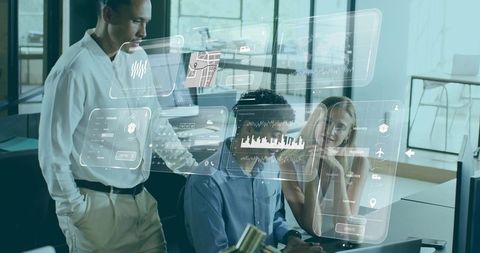 Team collaborating with holographic data dashboards while reviewing analytics and maps