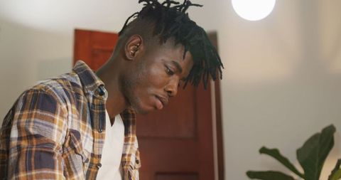 Focused African American Craftsman at Work in Workshop