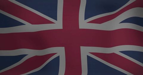 Waving United Kingdom Union Jack Flag Showcasing National Pride and Heritage