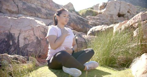 Mindful meditation and breathing outdoors in nature