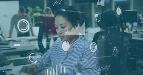 Businesswoman Analyzing Financial Data with Futuristic Interface in Office