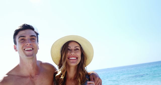 Young Couple Smiling on a Beach during a Summer Day - Download Free Stock Images Pikwizard.com