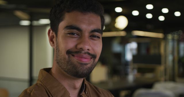 Smiling Bearded Man in Office Environment - Download Free Stock Images Pikwizard.com