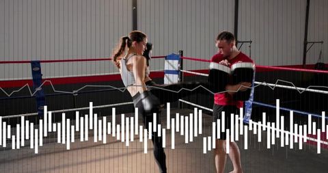 Female boxer kicking pad while trainer holding pads in boxing ring with waveform overlay