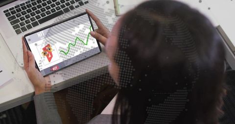 Woman analyzing nft trading on tablet with global data overlay