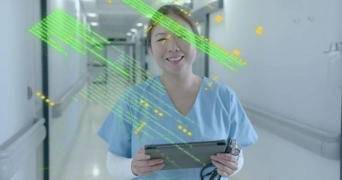 Smiling nurse using digital tablet with code overlay in hospital corridor